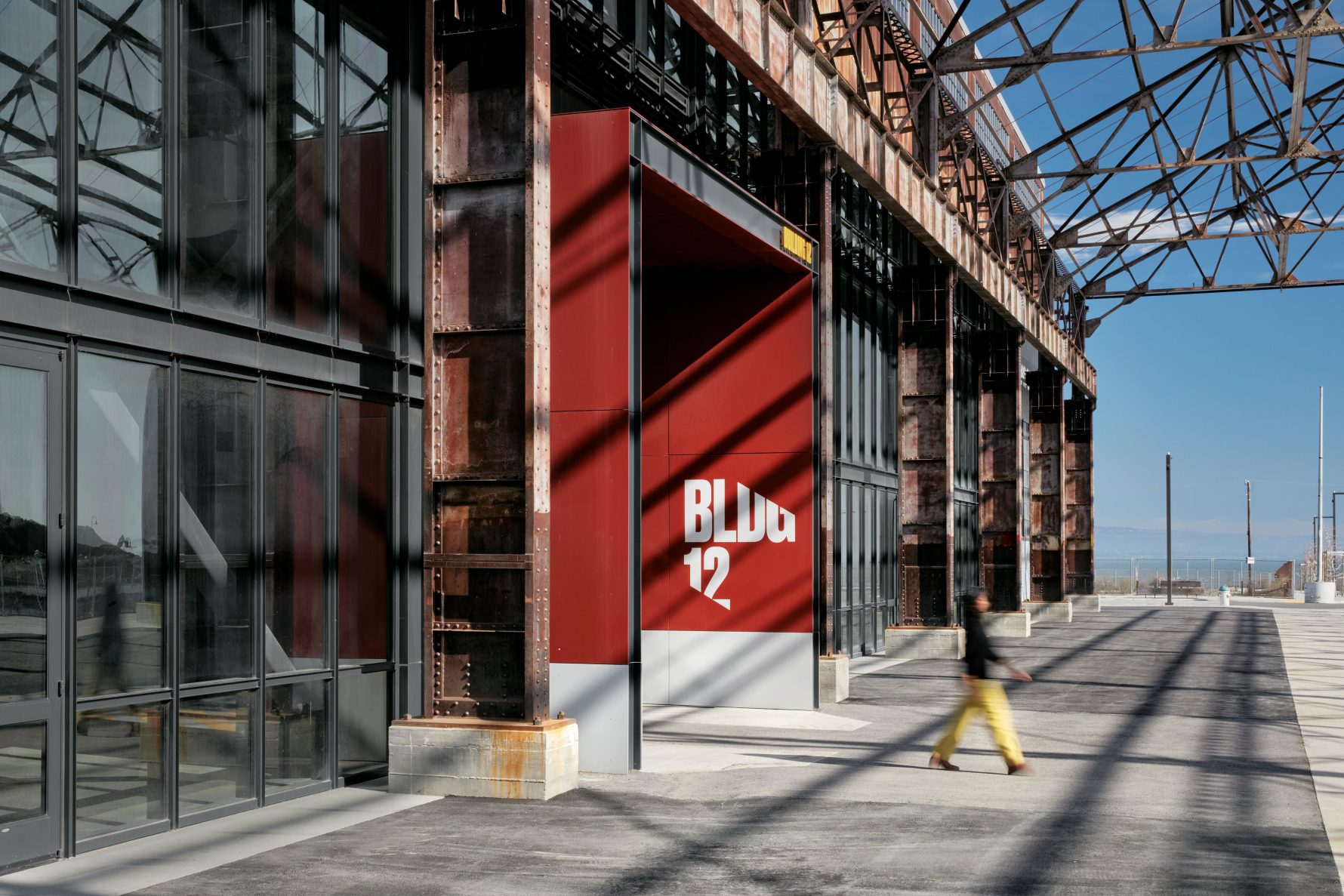 BLDG 12 signage on red entrance portal, riveted industrial facade of Building 12 at Pier 70, San Francisco